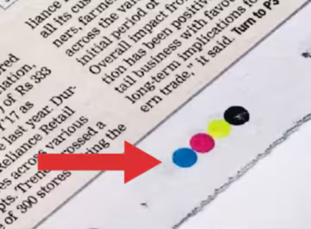 Why Do Newspapers Have Colored Dots at the Bottom?